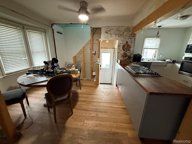 11311 Tecumseh, Redford, MI 48239 - dining area featuring a ceiling fan, light wood finished floors, beamed ceiling, and a desk
