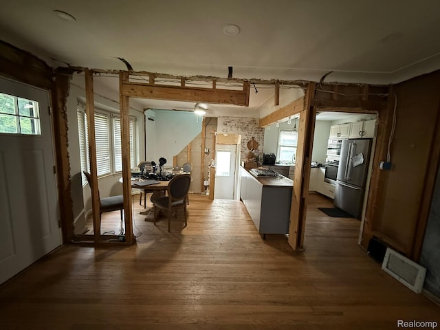 11311 Tecumseh, Redford, MI 48239 - kitchen featuring stainless steel appliances, wood finished floors, and a desk