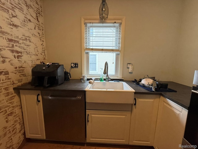 11311 Tecumseh, Redford, MI 48239 - kitchen with dishwasher, dark countertops, white cabinetry, and brick wall