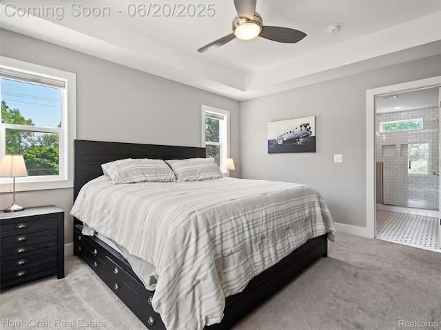 2213 Beverly Blvd, Berkley, MI 48072 - bedroom with light colored carpet, ceiling fan, connected bathroom, and a raised ceiling