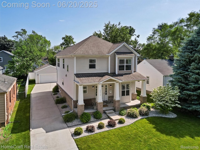 2213 Beverly Blvd, Berkley, MI 48072 - view of front facade featuring covered porch, a detached garage, a front yard, an outbuilding, and roof with shingles