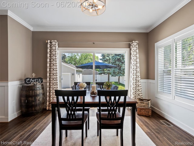 2213 Beverly Blvd, Berkley, MI 48072 - dining area featuring hardwood / wood-style floors, a chandelier, a wainscoted wall, and crown molding