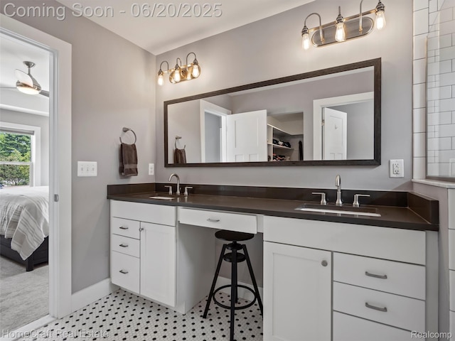 2213 Beverly Blvd, Berkley, MI 48072 - ensuite bathroom with double vanity and baseboards