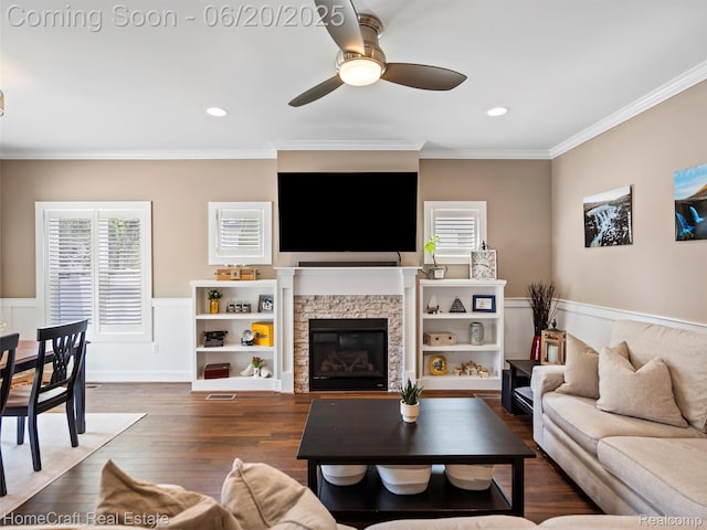 2213 Beverly Blvd, Berkley, MI 48072 - living area featuring ornamental molding, a ceiling fan, a fireplace, a wainscoted wall, and wood finished floors