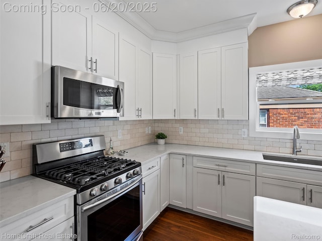 2213 Beverly Blvd, Berkley, MI 48072 - kitchen with stainless steel appliances, decorative backsplash, and white cabinets