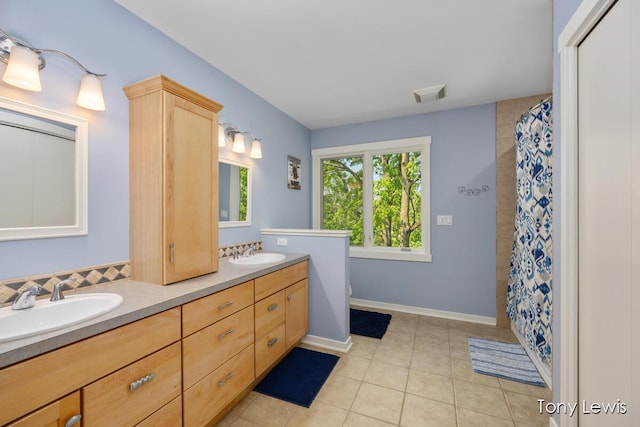 2331 Deer Trail Dr NE, Grand Rapids, MI 49505 - full bathroom with double vanity, tile patterned flooring, and curtained shower