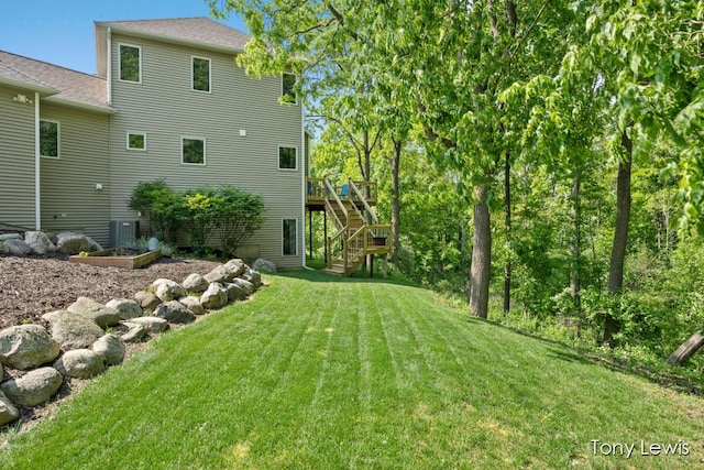 2331 Deer Trail Dr NE, Grand Rapids, MI 49505 - view of green lawn featuring stairway and a deck
