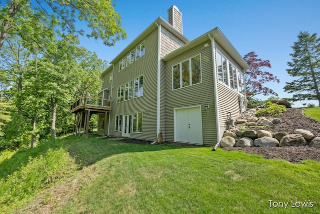 2331 Deer Trail Dr NE, Grand Rapids, MI 49505 - rear view of house with a lawn, a chimney, and a deck
