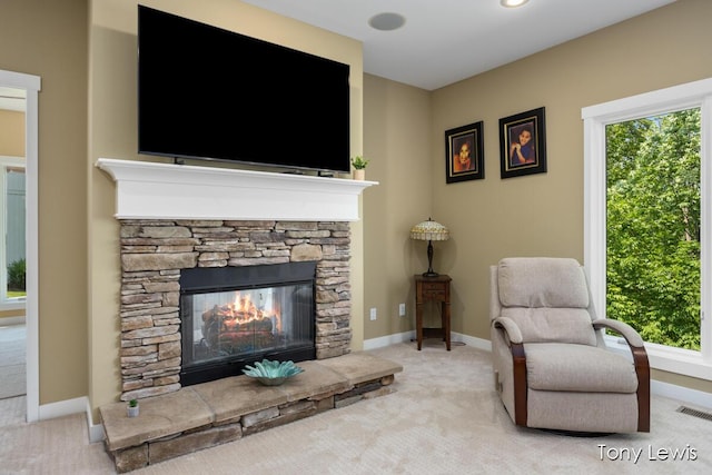 2331 Deer Trail Dr NE, Grand Rapids, MI 49505 - carpeted living room with a fireplace and baseboards