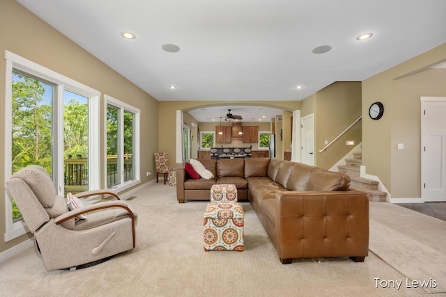 2331 Deer Trail Dr NE, Grand Rapids, MI 49505 - living room with light carpet, arched walkways, recessed lighting, and stairs