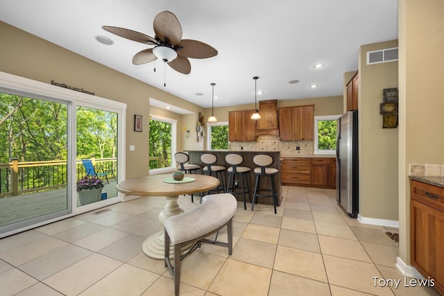 2331 Deer Trail Dr NE, Grand Rapids, MI 49505 - dining space featuring light tile patterned floors and ceiling fan