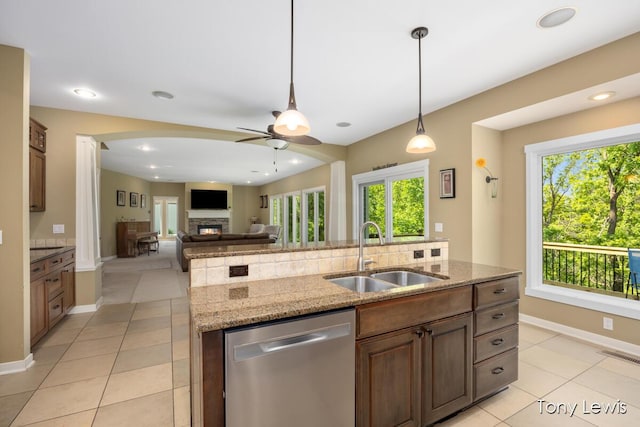 2331 Deer Trail Dr NE, Grand Rapids, MI 49505 - kitchen with dishwasher, ceiling fan, a stone fireplace, plenty of natural light, and recessed lighting
