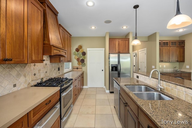 2331 Deer Trail Dr NE, Grand Rapids, MI 49505 - kitchen featuring stainless steel appliances, custom exhaust hood, brown cabinets, and recessed lighting