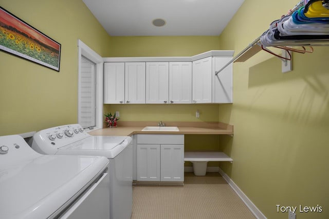 2331 Deer Trail Dr NE, Grand Rapids, MI 49505 - laundry room featuring washing machine and dryer, cabinet space, and light colored carpet