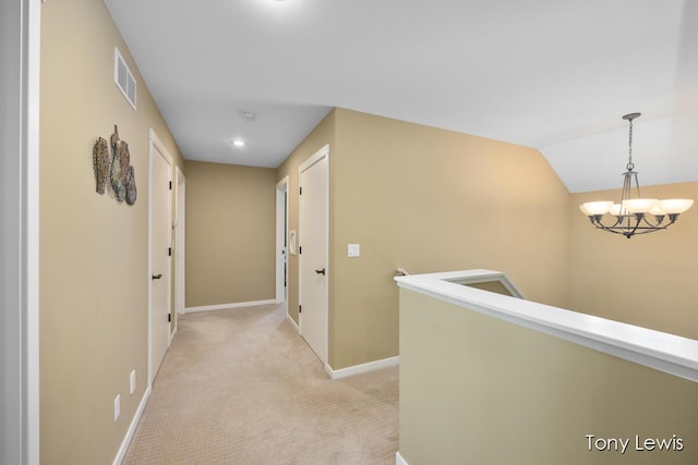 2331 Deer Trail Dr NE, Grand Rapids, MI 49505 - corridor with light colored carpet, a chandelier, and an upstairs landing
