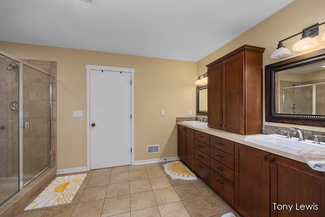 2331 Deer Trail Dr NE, Grand Rapids, MI 49505 - bathroom with double vanity, a shower stall, and tile patterned flooring