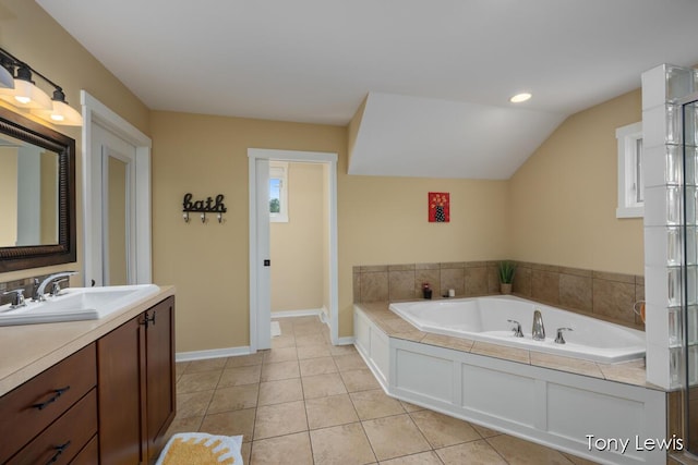 2331 Deer Trail Dr NE, Grand Rapids, MI 49505 - bathroom with vanity, a garden tub, tile patterned floors, and lofted ceiling