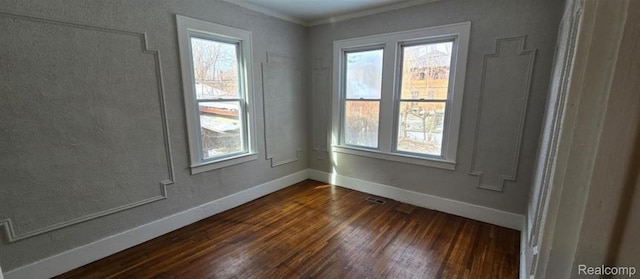 3014 Sturtevant St, Detroit, MI 48206 - spare room with healthy amount of natural light, dark wood-style floors, and crown molding