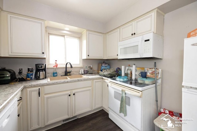 6200 Jackman Rd, Temperance, MI 48182 - kitchen with white appliances, light countertops, and dark wood finished floors