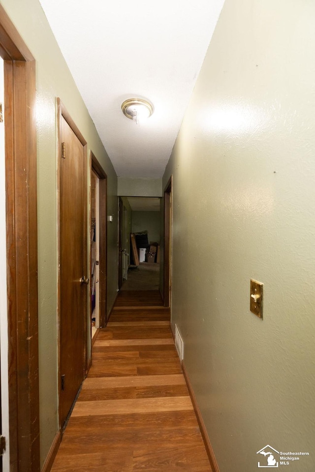 6200 Jackman Rd, Temperance, MI 48182 - hallway with light wood-type flooring and baseboards