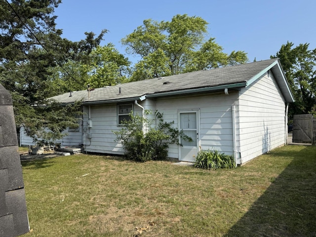 2456 Kurt Rd, Benton Harbor, MI 49022 - back of house with a yard and roof with shingles