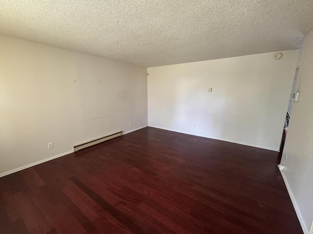 2456 Kurt Rd, Benton Harbor, MI 49022 - empty room with a baseboard radiator, wood finished floors, and a textured ceiling