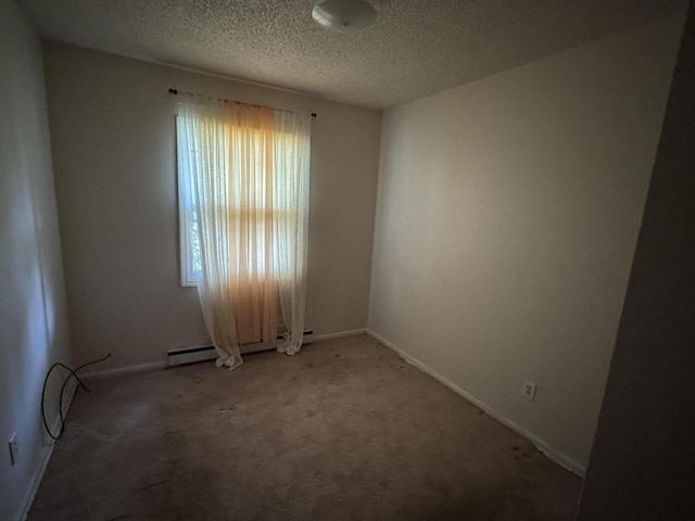 2456 Kurt Rd, Benton Harbor, MI 49022 - empty room with carpet floors, a textured ceiling, and a baseboard radiator