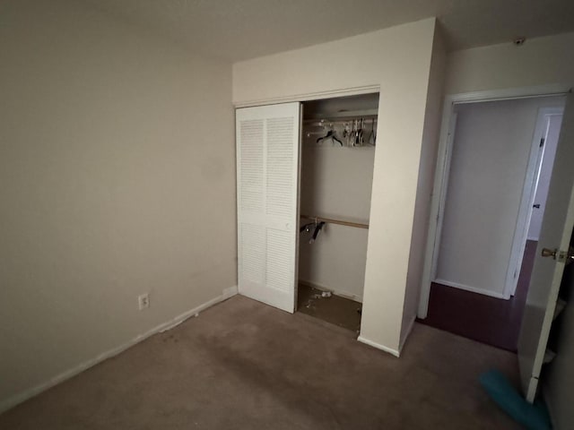 2456 Kurt Rd, Benton Harbor, MI 49022 - unfurnished bedroom featuring a closet and carpet flooring