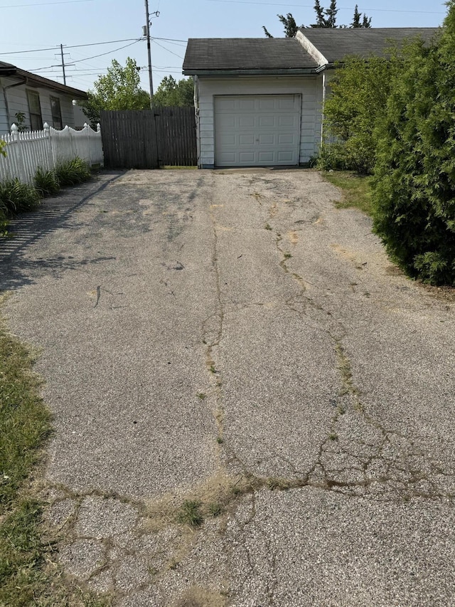 2456 Kurt Rd, Benton Harbor, MI 49022 - garage with asphalt driveway