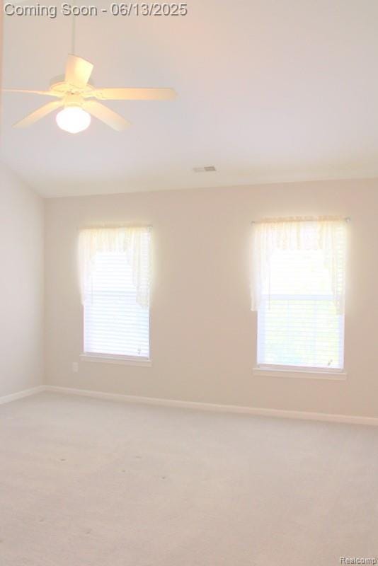 23413 Williamsburg Cir Unit 12, Woodhaven, MI 48183 - empty room with light colored carpet and ceiling fan