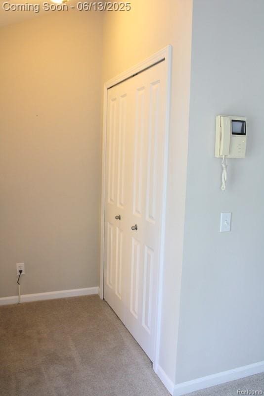 23413 Williamsburg Cir Unit 12, Woodhaven, MI 48183 - unfurnished bedroom featuring light carpet and a closet