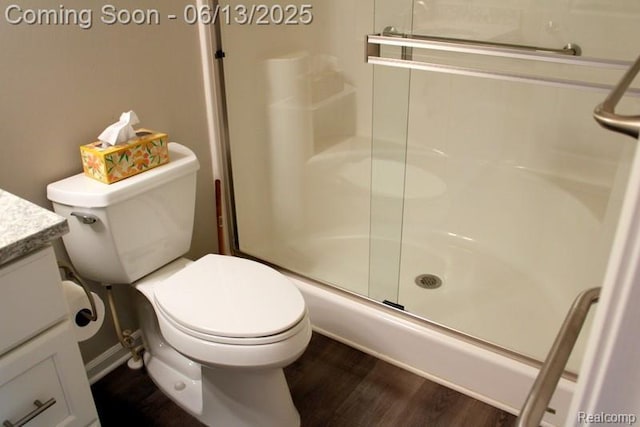 23413 Williamsburg Cir Unit 12, Woodhaven, MI 48183 - bathroom with an enclosed shower, vanity, and wood finished floors