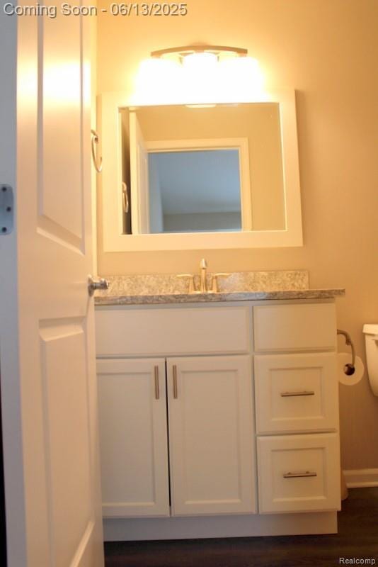 23413 Williamsburg Cir Unit 12, Woodhaven, MI 48183 - bathroom with vanity and toilet
