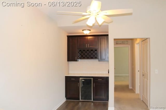 23413 Williamsburg Cir Unit 12, Woodhaven, MI 48183 - indoor dry bar featuring beverage cooler and ceiling fan