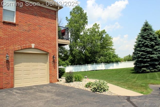23413 Williamsburg Cir Unit 12, Woodhaven, MI 48183 - garage with asphalt driveway