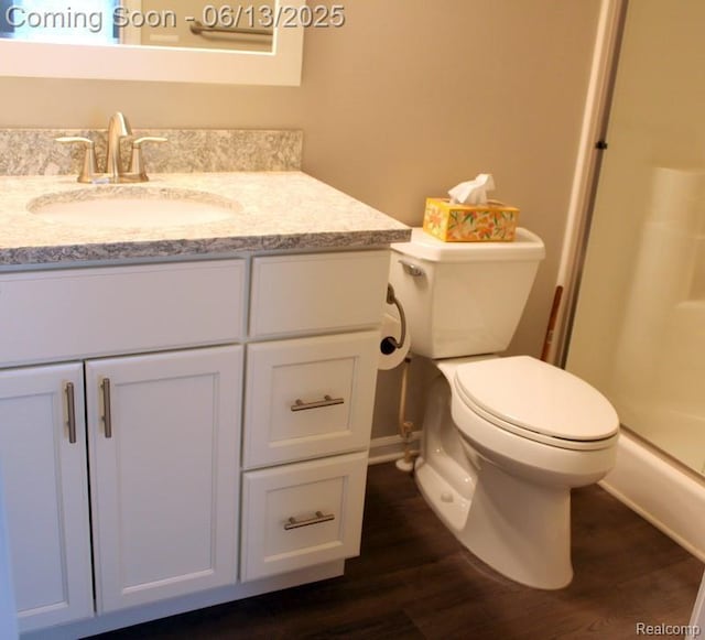 23413 Williamsburg Cir Unit 12, Woodhaven, MI 48183 - full bathroom featuring vanity, wood finished floors, and a shower stall