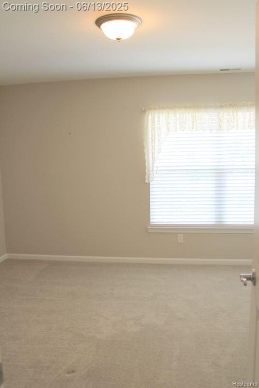23413 Williamsburg Cir Unit 12, Woodhaven, MI 48183 - empty room with carpet floors and baseboards