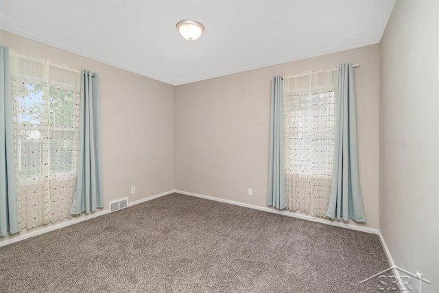 1601 S Monroe St, Bay City, MI 48708 - carpeted empty room featuring baseboards