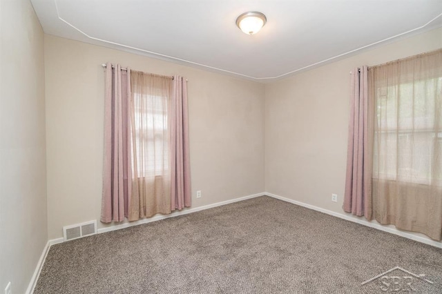 1601 S Monroe St, Bay City, MI 48708 - carpeted empty room featuring baseboards