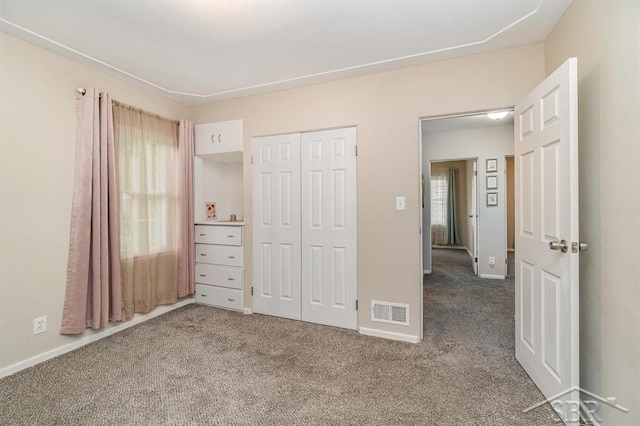 1601 S Monroe St, Bay City, MI 48708 - unfurnished bedroom with carpet floors and a closet