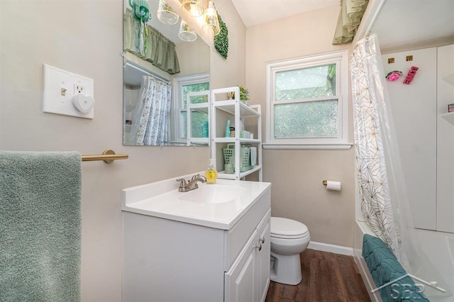 1601 S Monroe St, Bay City, MI 48708 - bathroom featuring vanity, wood finished floors, and shower / tub combo