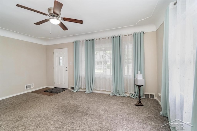 1601 S Monroe St, Bay City, MI 48708 - carpeted foyer entrance with ceiling fan and baseboards