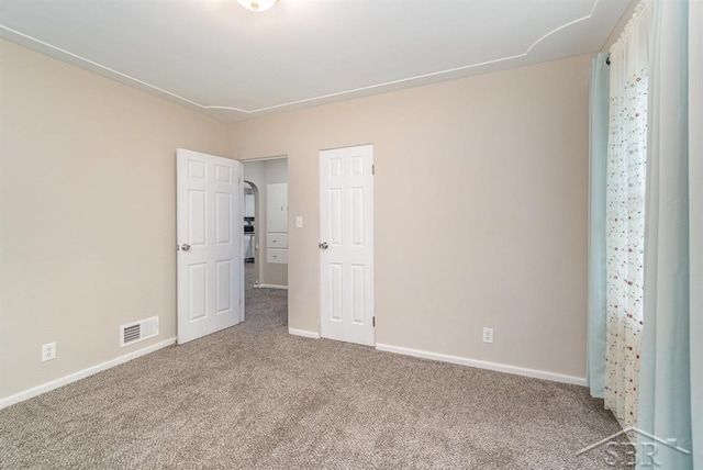 1601 S Monroe St, Bay City, MI 48708 - unfurnished bedroom featuring carpet and baseboards