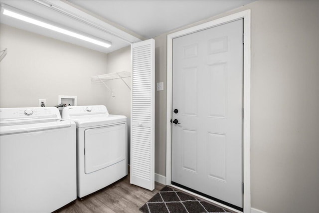 1178 Drent Rd, Muskegon, MI 49442 - washroom featuring washing machine and clothes dryer and wood finished floors
