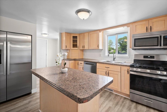 1178 Drent Rd, Muskegon, MI 49442 - kitchen with appliances with stainless steel finishes, light brown cabinetry, decorative backsplash, and light wood-style flooring