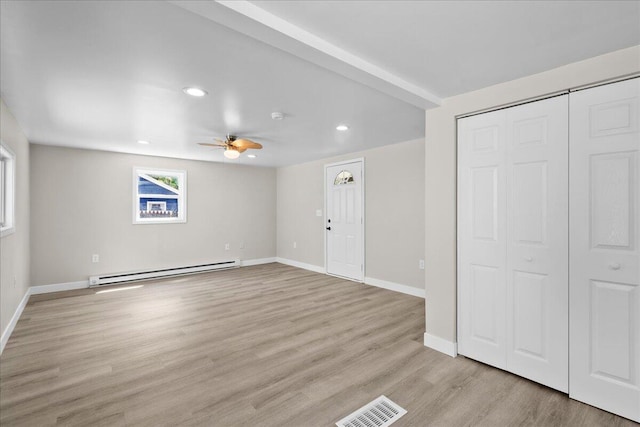 1178 Drent Rd, Muskegon, MI 49442 - unfurnished living room featuring baseboard heating, recessed lighting, a ceiling fan, and light wood finished floors