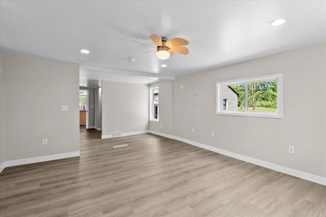 1178 Drent Rd, Muskegon, MI 49442 - empty room with a ceiling fan, light wood-type flooring, and recessed lighting