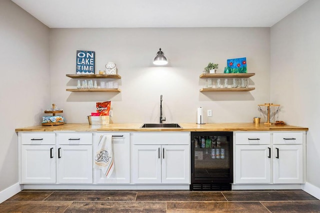 2753 Colton Dr, Berrien Springs, MI 49103 - indoor wet bar with beverage cooler and dark wood finished floors