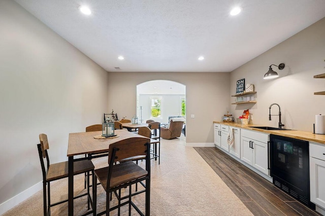 2753 Colton Dr, Berrien Springs, MI 49103 - dining area with arched walkways, recessed lighting, and dark wood-style floors