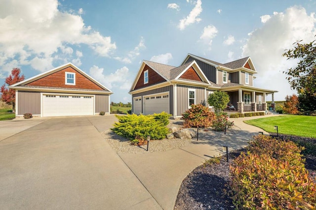 2753 Colton Dr, Berrien Springs, MI 49103 - craftsman-style house with board and batten siding, a porch, a garage, and a front lawn